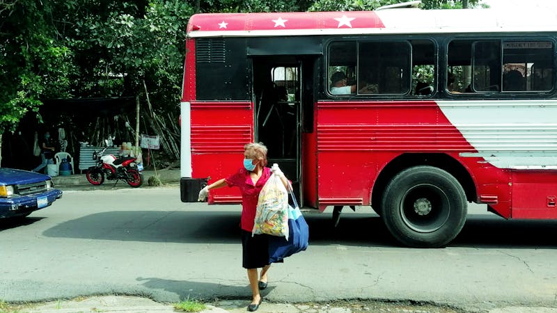 Person reading supplement nutrition label for omega-3 content
