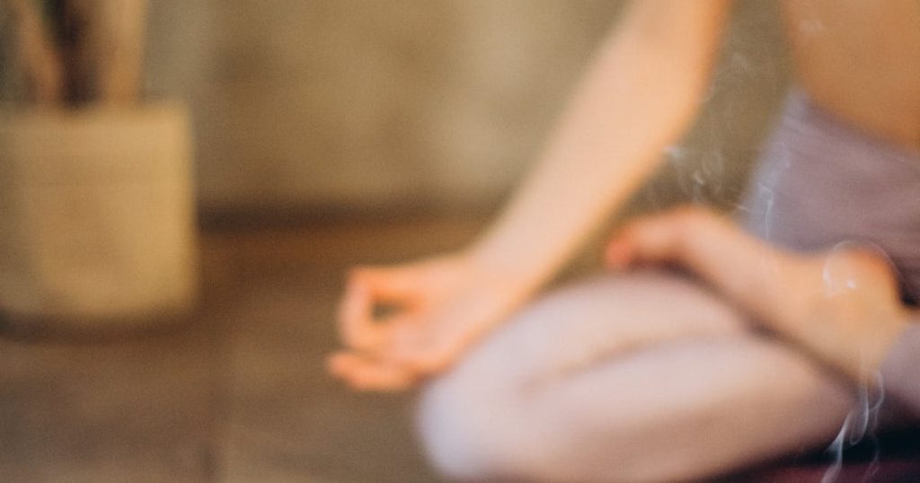 Woman meditating peacefully for stress and anxiety relief